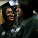An Eastern Michigan University graduate looks for family members during the Spring Commencement on Sunday, April 28. Daniel Brenner I AnnArbor.com